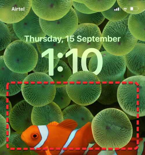 如何在 iOS 16 中將時間置於壁紙後面