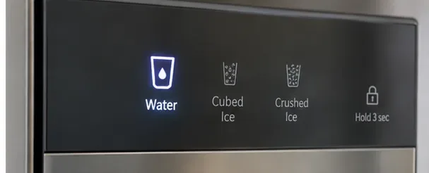 A refrigerator dispenser control panel showing Water mode and a lock icon after cleaning.