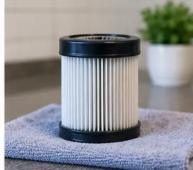 Clean vacuum filter standing on a towel to air-dry completely