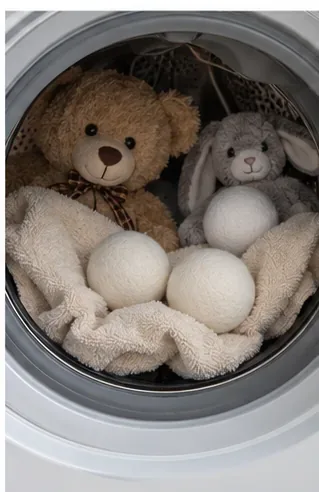 Teddy bear and rabbit plush toys inside a clothes dryer with soft dryer balls